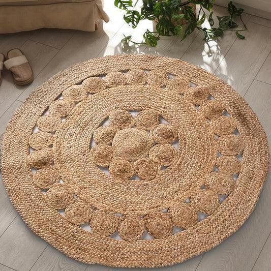 Natural brown round braided jute rug with circle pattern